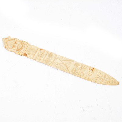 Lot 204 - Carved bone paperknife, Native American iconography