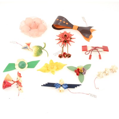 Lot 302 - Eleven vintage wartime austerity chic celluloid brooches and pins.