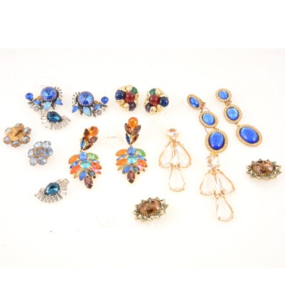 Lot 323 - Eight pairs of large coloured paste set earclips, Butler & Wilson, Emmons, Askew, Schreiner.