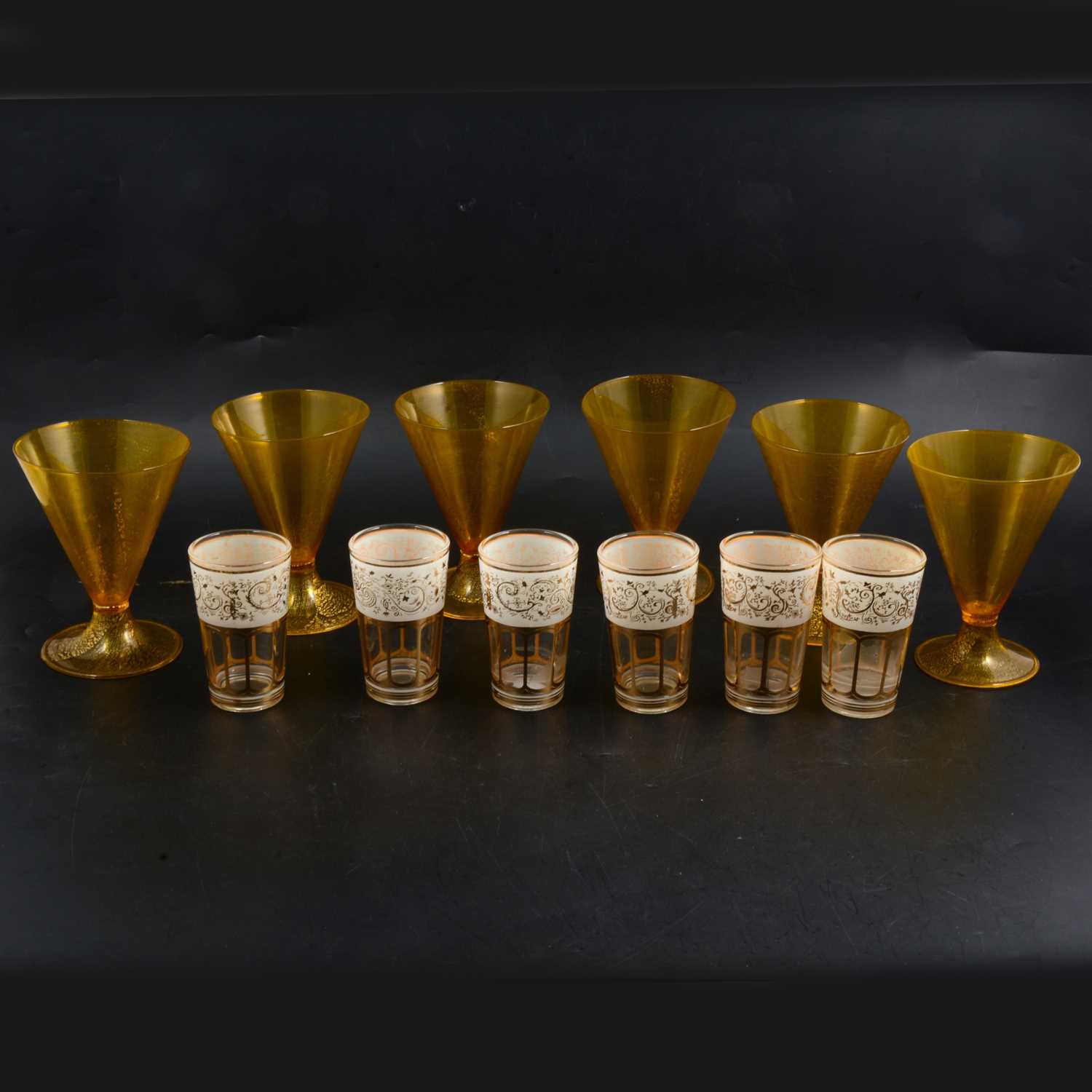 Lot 64 - Set of Murano lemon tinted conical-shaped wine glasses, plus gilt decoration beakers.