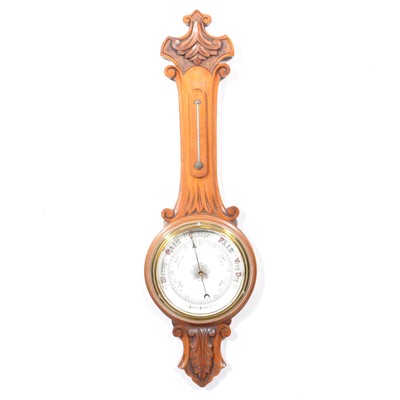 Lot 396 - Carved walnut aneroid barometer