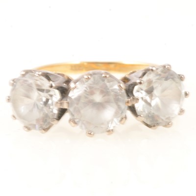 Lot 289 - Three stone ring set with synthetic white stones marked 18ct.