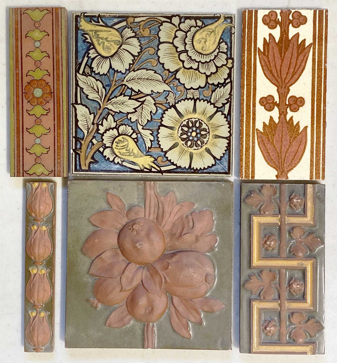 Lot 143 - A Victorian decorative tile in relief by Maw & Co, and others.