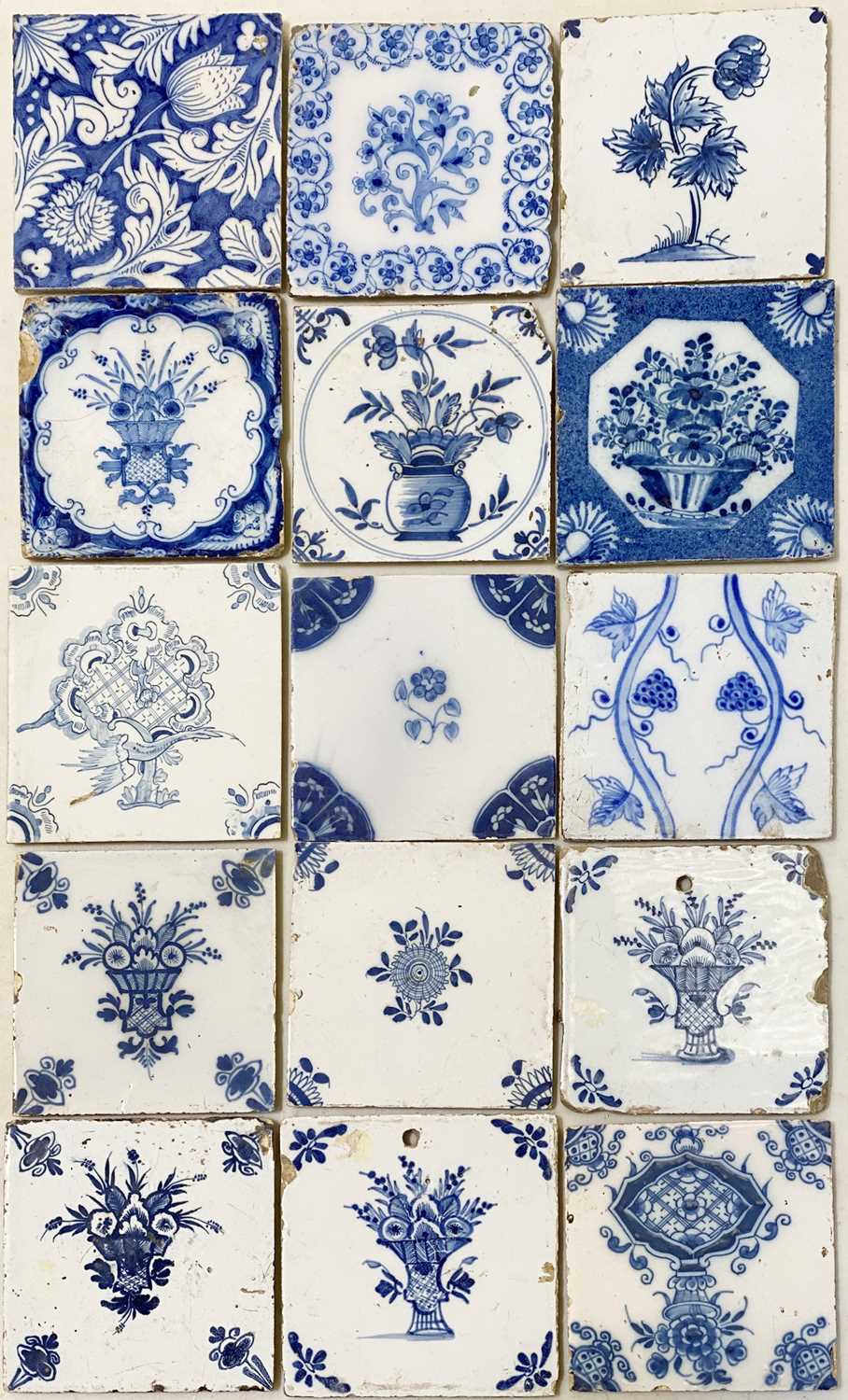 Lot 81 - Fifteen Dutch Delft blue and white tiles, floral designs.