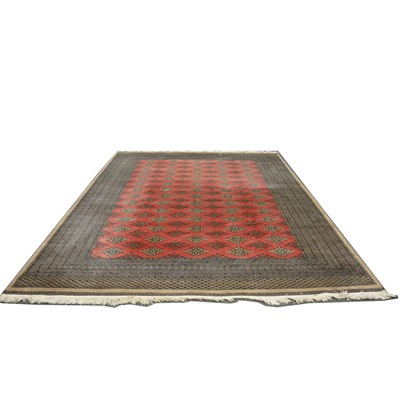 Lot 477 - Bokhara carpet, with five rows of lozenge-shape medallions