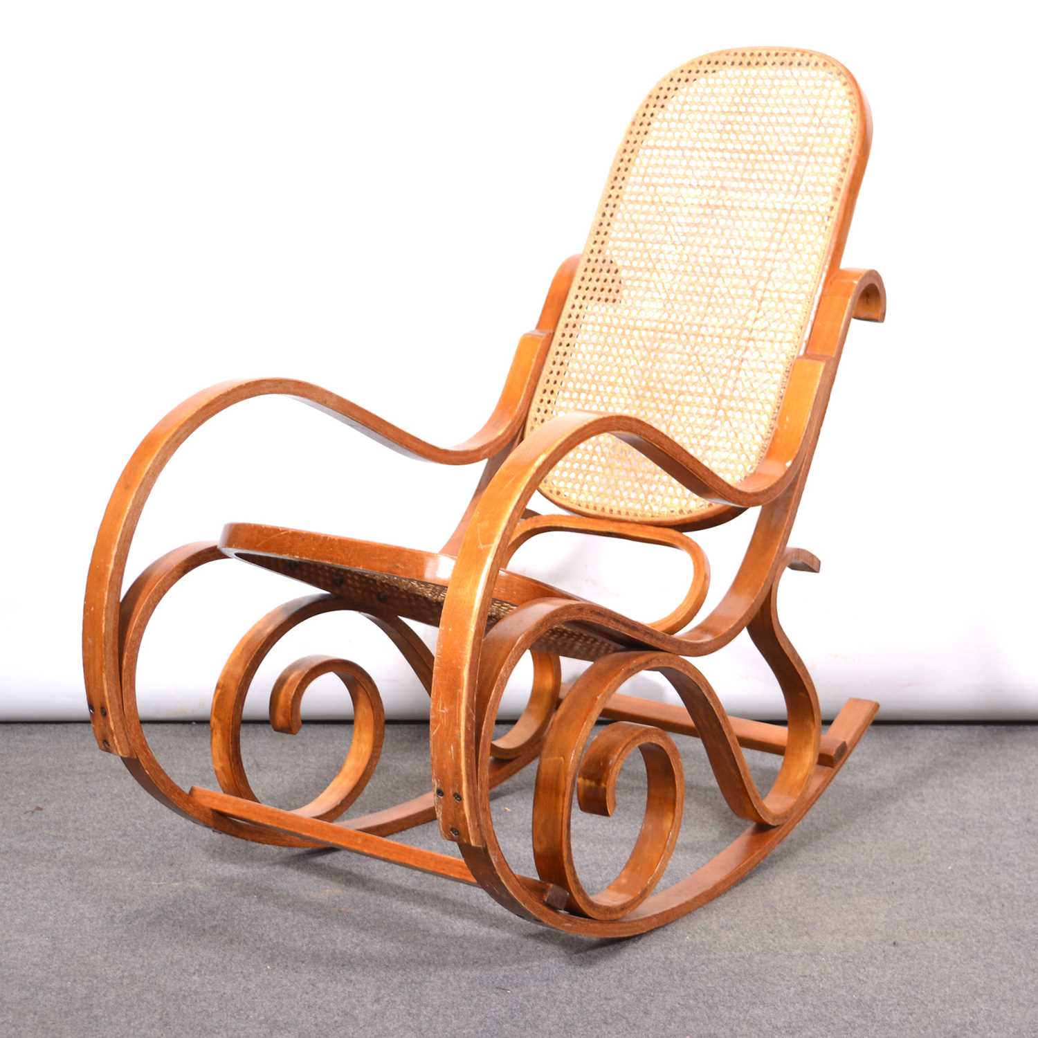 Vintage bent ply and cane panelled rocking chair | Barnebys