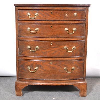 Lot 328 - Small oak bowfront chest of drawers