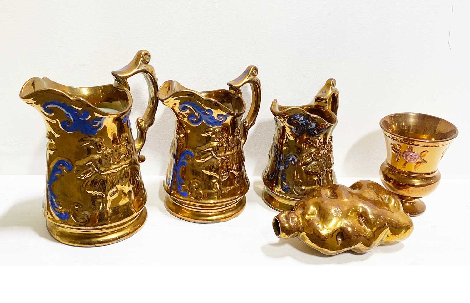 Lot 54 - Collection of copper lustre jugs and related items.