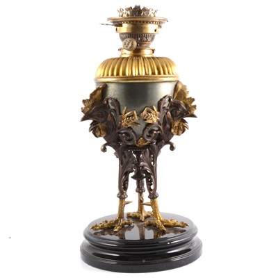 Lot 104 - Bronzed and gilt metal oil lamp