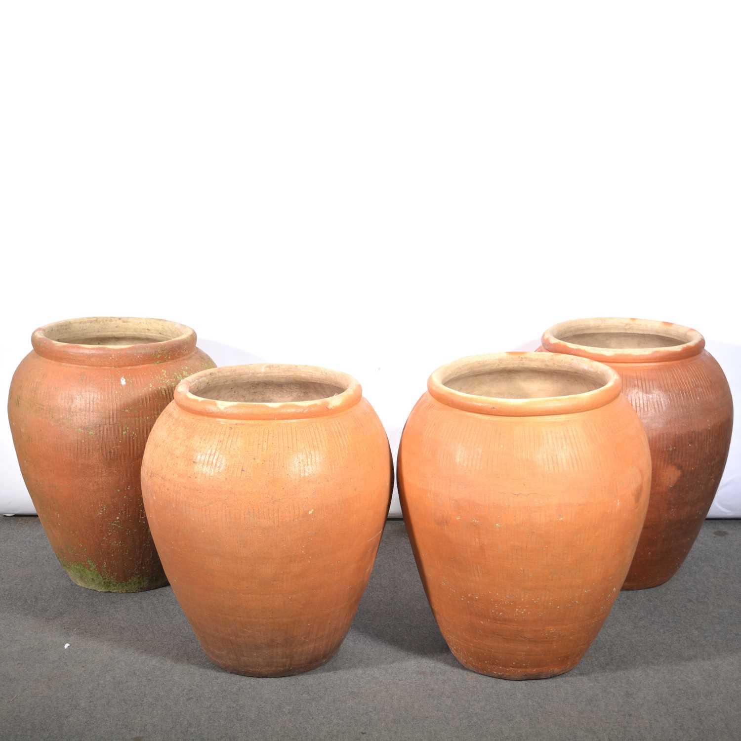 Lot 680 - Four large Ali-Baba garden planters.