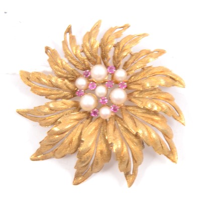 Lot 301 - An 18 carat yellow gold textured leaf design brooch set with rubies and pearls.