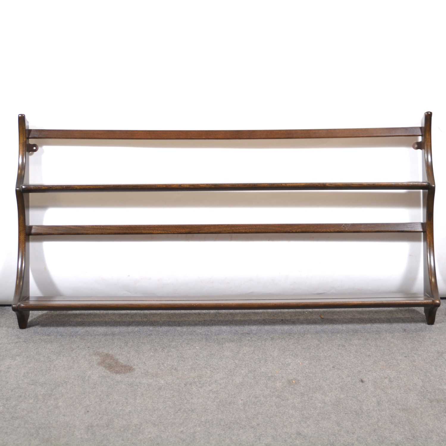 Lot 516 Ercol elm wall shelf,