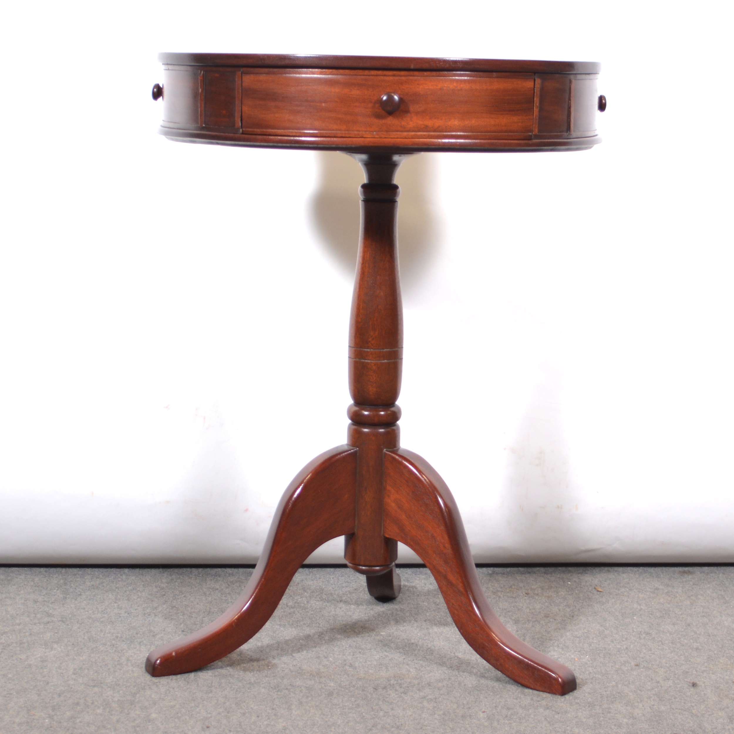 Lot 515 Reproduction mahogany drumtop table,