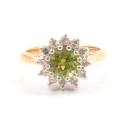 Lot 297 - Peridot and diamond cluster ring.