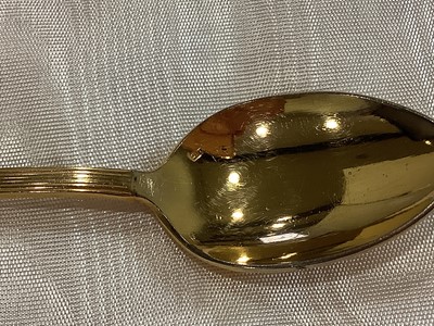 Lot 141 - Set of twelve gilt metal coffee spoons, retailed by Daniel Cregut, Paris.