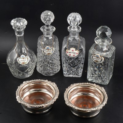 Lot 32 - Four glass decanters with pair of electroplated coasters and Royal Staffordshire labels.