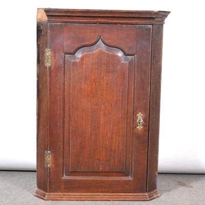 Lot 428 - George III oak hanging corner cupboard