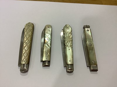 Lot 154 - Four mother-of-pearl and silver folding fruit knives.