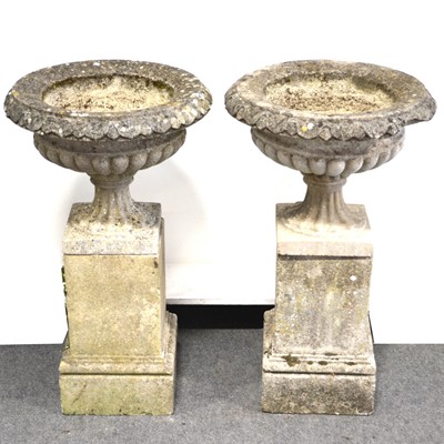 Lot 500 - Set of four cast stone campana garden urns