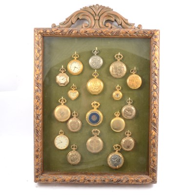 Lot 324 - Eighteen modern pocket watches in a display case.