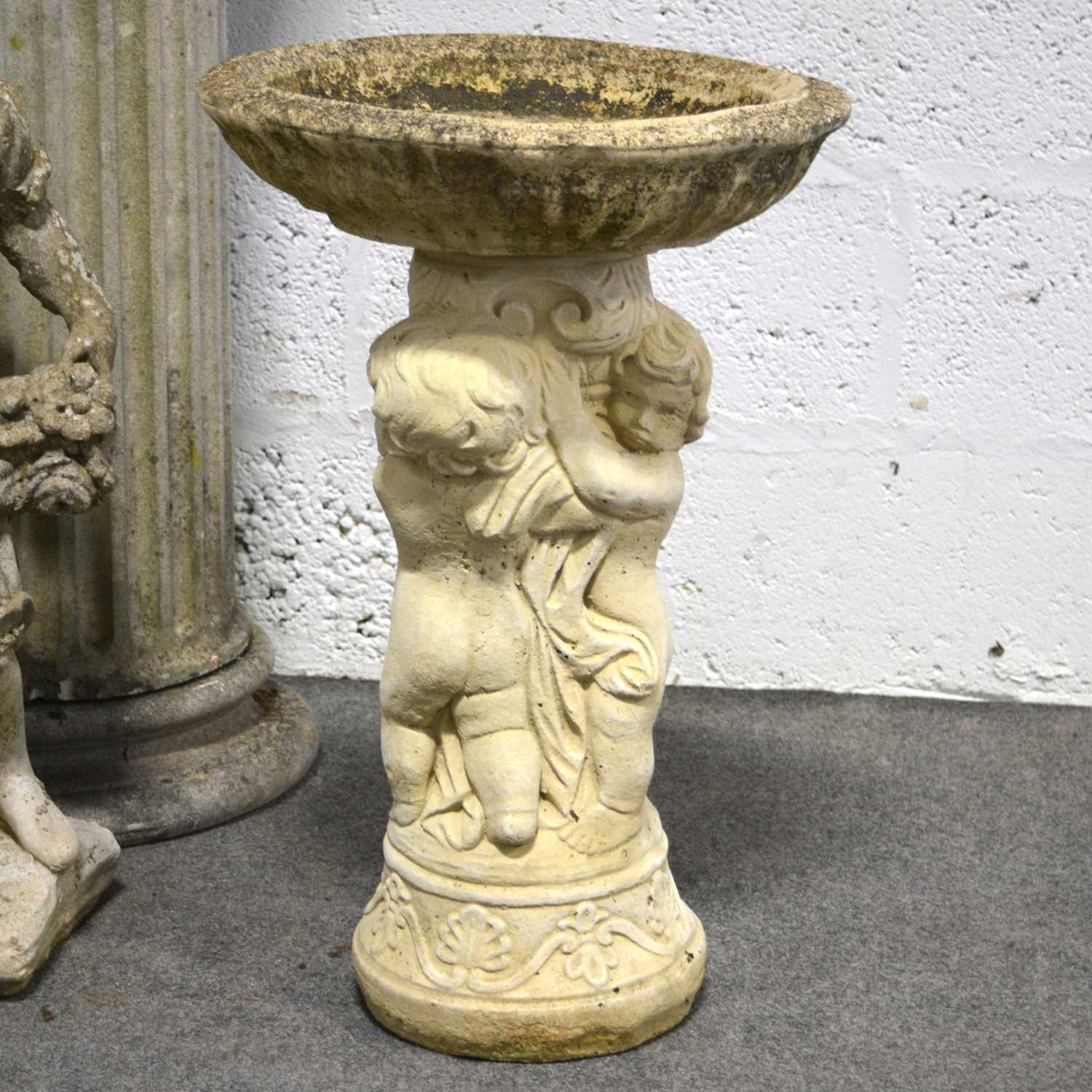 cast concrete bird bath        
        <figure class=