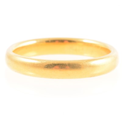 Lot 274 - A 22 carat yellow gold wedding band.