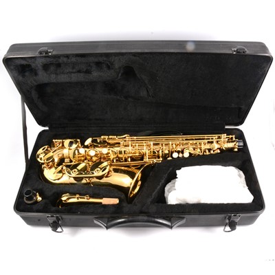 Lot 152 - Voggenreiter alto saxophone - cased and three basic music books.