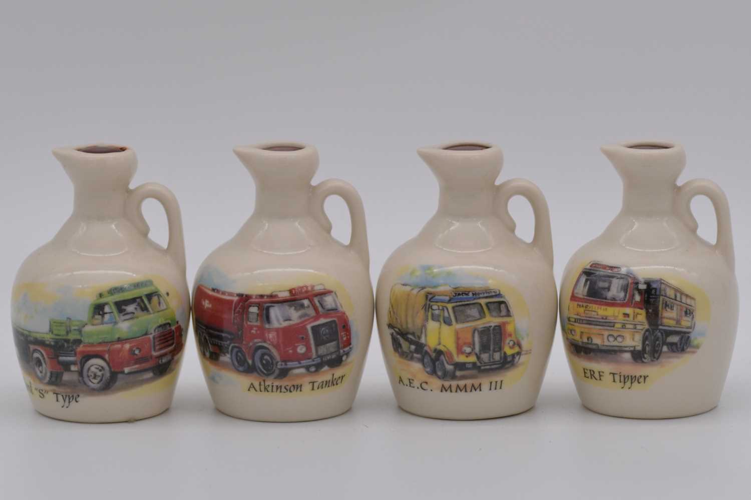 Lot 104 - Twenty four assorted Rutherford's ceramic decanters
