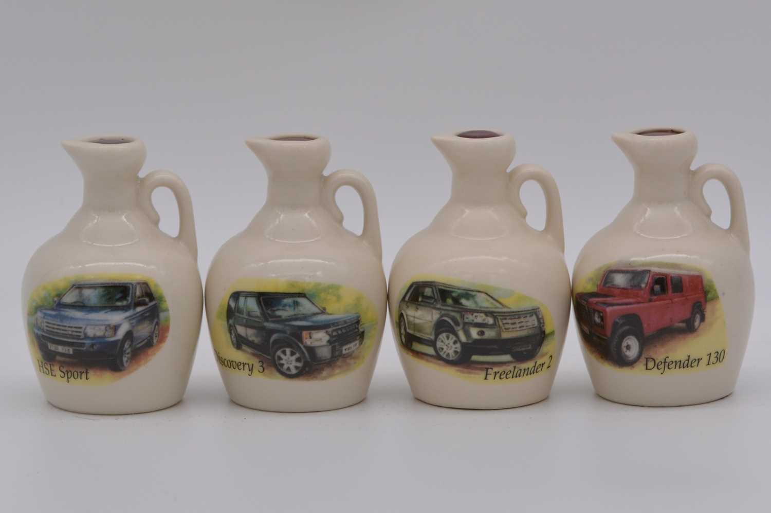 Lot 106 - Twenty four assorted Rutherford's white ceramic decanters, vintage automobiles