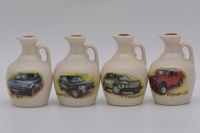Lot 106 - Twenty four assorted Rutherford's white ceramic decanters, vintage automobiles