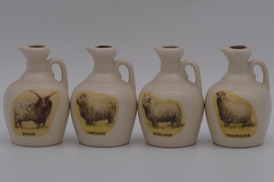 Lot 123 - Twenty one assorted Rutherford's white ceramic decanters, sheep breeds and cattle