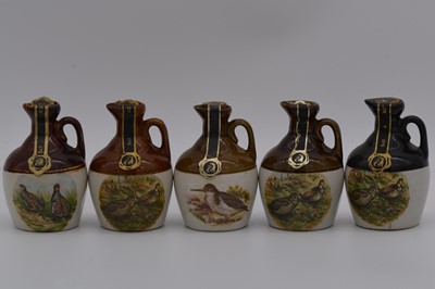 Lot 125 - Twenty one assorted Rutherford's ceramic decanters, birds and animals