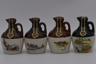 Lot 66 - Twenty four assorted Rutherford's ceramic decanters, sporting series