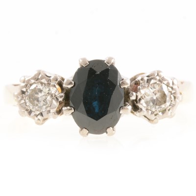 Lot 266 - Sapphire and diamond three stone ring.