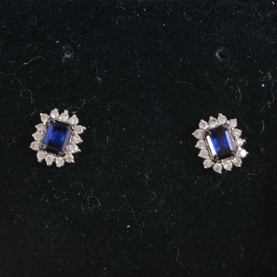 Lot 187 - Pair of rectangular sapphire and diamond earstuds..