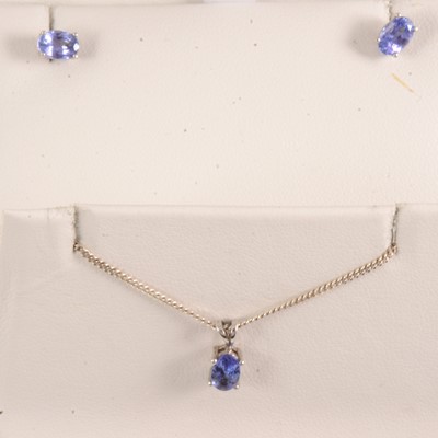 Lot 233 - Tanzanite pendant and matching earstuds.