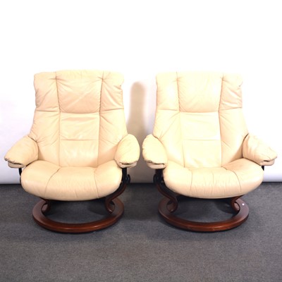 Lot 421 - Pair of Stressless leather easy chairs and one footstool