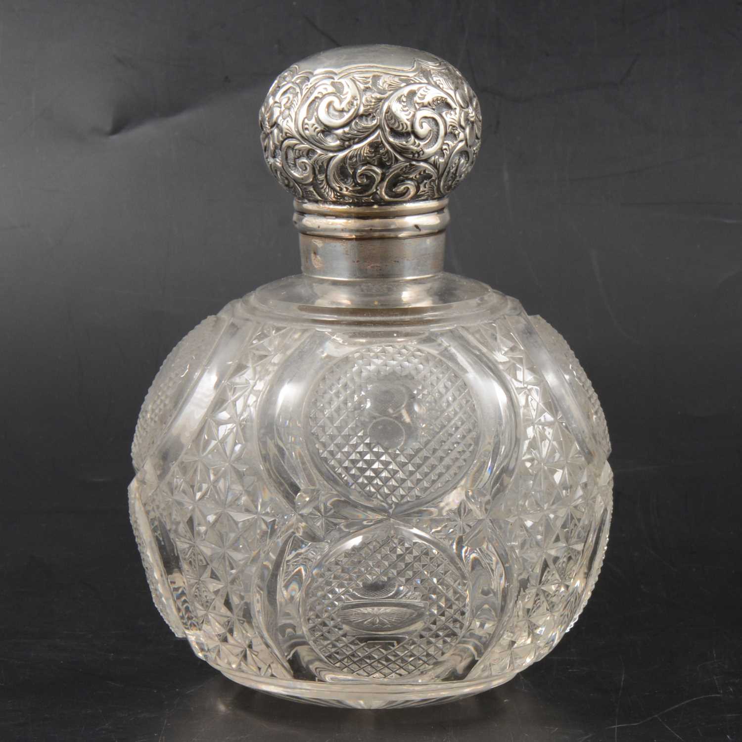 Lot 246 - Edwardian silver-mounted glass scent bottle.