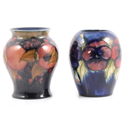 Lot 44 - Moorcroft Pottery 'Pomegranate' and 'Pansy' vases.