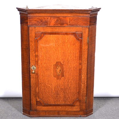 Lot 445 - George III oak and mahogany hanging corner cupboard