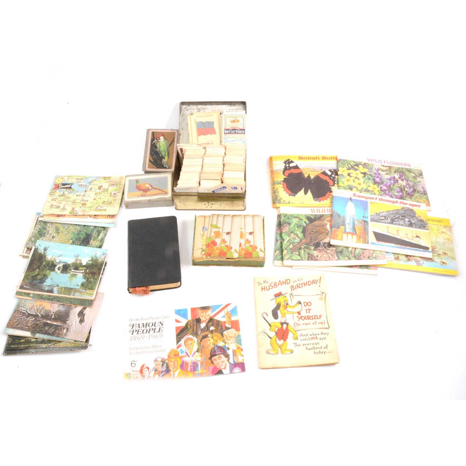 Lot 83 - Postcard album, cigarette and trade cards, playing cards and a bible.