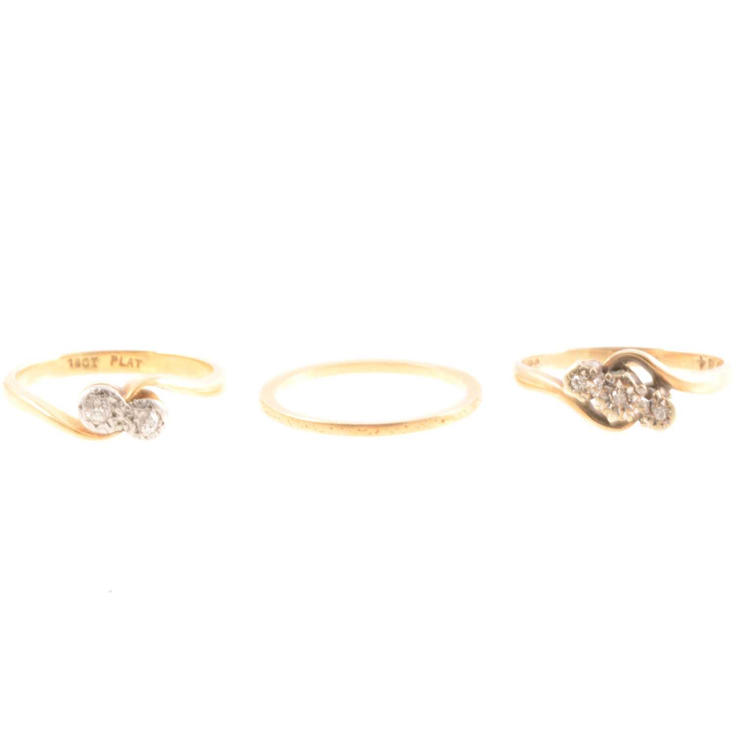 Lot 158 - Two diamond set rings and a wedding ring.