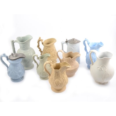 Lot 64 - Nine assorted Victorian relief-moulded decorative jugs.