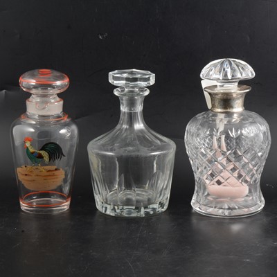 Lot 35 - Cut-glass and silver-mounted decanter, and two others
