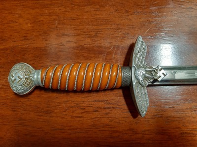 Lot 135 - Three replica German dress daggers and a replica socket bayonet