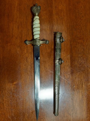 Lot 135 - Three replica German dress daggers and a replica socket bayonet