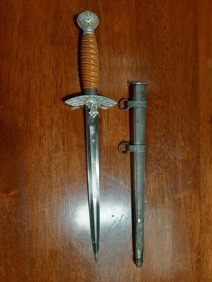 Lot 135 - Three replica German dress daggers and a replica socket bayonet