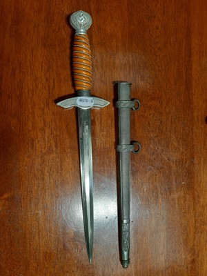 Lot 135 - Three replica German dress daggers and a replica socket bayonet