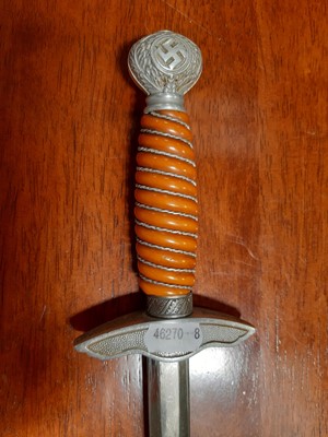 Lot 135 - Three replica German dress daggers and a replica socket bayonet