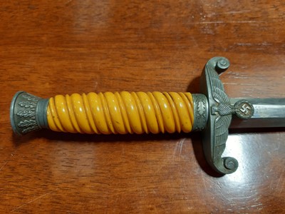 Lot 135 - Three replica German dress daggers and a replica socket bayonet